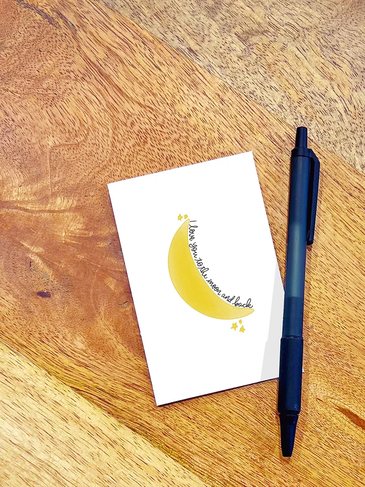 a mini greeting card that says love you to the moon and back