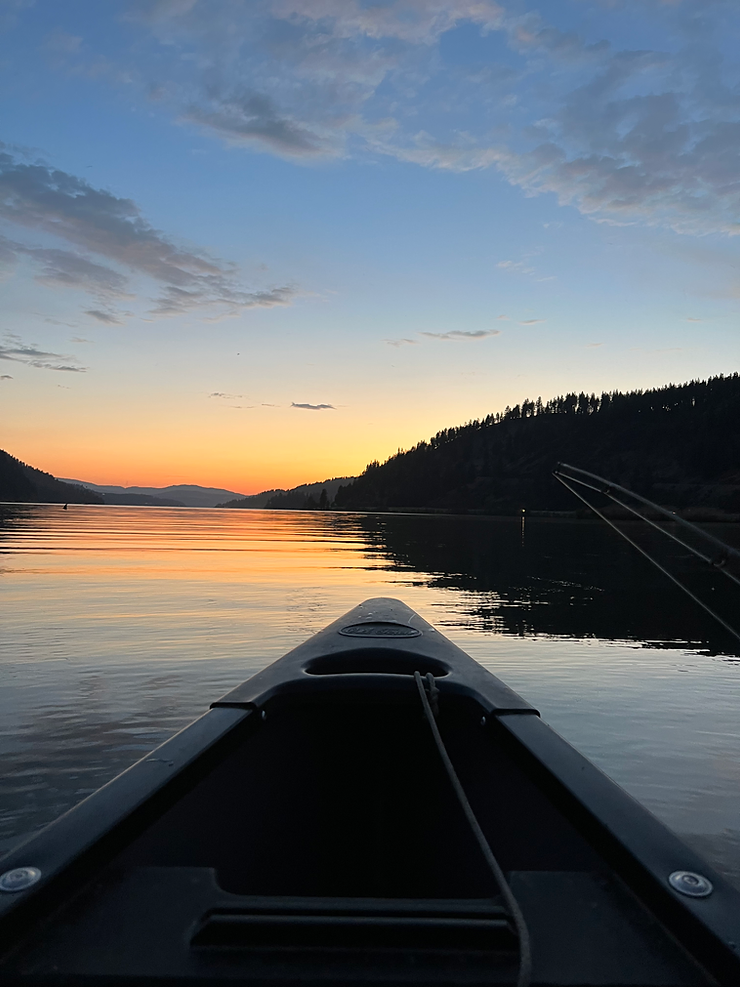 canoe on lake Couer d' alene at sunset