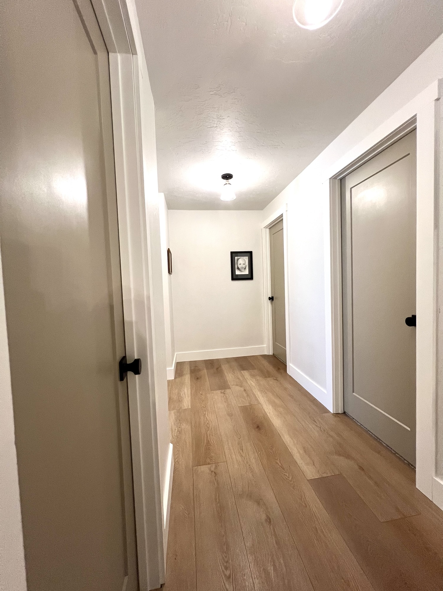 The Updated Upstairs Hallway – New Doors and Trim